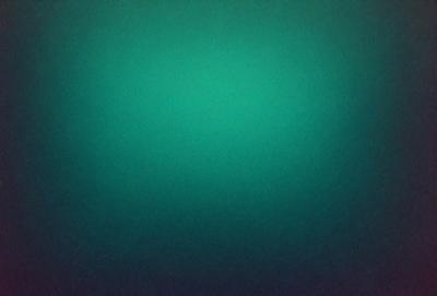 The primary subject of the image is a green background. The setting is a dark, possibly underwater, environment. The visual style is a close-up of the green background, which appears to be a pattern or texture. The colors and mood of the image are predominantly dark and moody, with the green background providing a contrasting element.