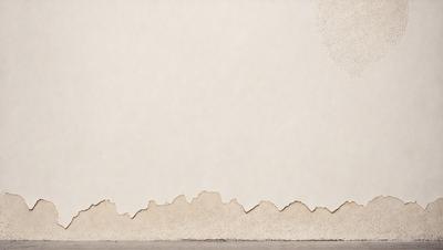 The primary subject of the image is a white wall with a pattern of holes in it. The setting is a room with a white wall, and the visual style appears to be a photo. The dominant colors are white and grey, creating a clean and minimalist atmosphere.