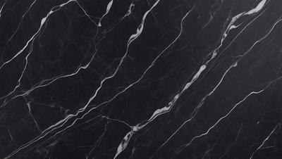 The primary subject of the image is a black marble countertop. The setting is a kitchen, with the countertop being the main focus of the scene. The visual style is a close-up of the marble countertop, showcasing its texture and pattern. The colors and mood of the image are predominantly dark, with the black marble countertop being the main source of contrast.