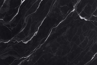 The primary subject of the image is a black marble countertop. The setting is a kitchen, with the countertop being the main focus of the scene. The visual style is a close-up of the marble countertop, showcasing its texture and pattern. The colors and mood of the image are predominantly dark, with the black marble countertop being the main source of contrast.