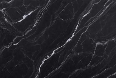 The primary subject of the image is a black marble countertop with a pattern of white swirls. The setting is a kitchen, and the visual style is a close-up of the marble countertop. The dominant colors are black and white, creating a sleek and modern atmosphere.