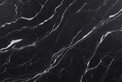 The primary subject of the image is a black marble countertop. The setting is a kitchen, with the countertop being the main focus of the scene. The visual style is a close-up of the marble countertop, showcasing its texture and pattern. The colors and mood of the image are predominantly dark, with the black marble countertop being the main source of contrast.
