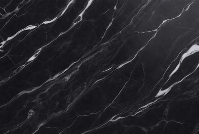 The primary subject of the image is a marble countertop with a black and white pattern. The setting is a kitchen, and the visual style is a close-up of the marble countertop. The colors and mood of the image are predominantly black and white, giving it a classic and elegant appearance.