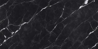 The primary subject of the image is a black marble countertop. The setting is a kitchen, with the countertop being the main focus of the scene. The visual style is a close-up of the marble countertop, showcasing its texture and pattern. The colors and mood of the image are predominantly black, giving it a sleek and modern appearance.