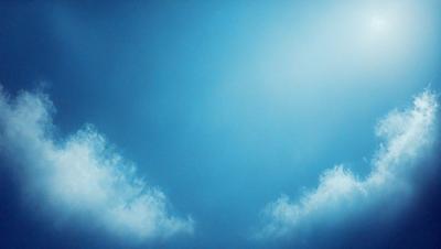 The primary subject of the image is a clear blue sky with a few clouds. The setting is a vast, open space with no visible landmarks or objects. The visual style is a natural, outdoor scene with a focus on the sky and clouds. The colors and mood are predominantly blue and serene, creating a peaceful and tranquil atmosphere.