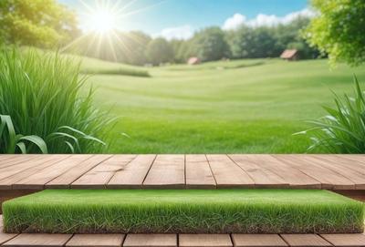 The primary subject of the image is a wooden deck or platform, which is situated in a lush green field. The setting is a grassy area with trees in the background, creating a serene and natural environment. The visual style of the image is a combination of photo and digital art, giving it a realistic yet artistic appearance. The dominant colors in the image are green, which represents the grass and the field, and brown, which is the color of the wooden deck. The overall atmosphere of the image is calm and peaceful,