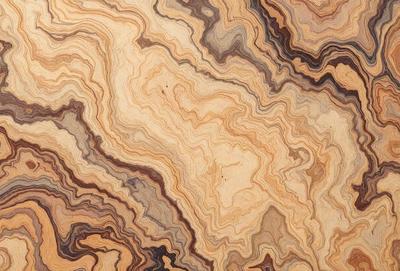 The primary subject of the image is a wooden table with a unique and intricate pattern on its surface. The table appears to be made of wood and has a natural texture. The setting is indoors, with the table being the main focus of the scene. The visual style of the image is a close-up of the wooden table, showcasing its distinctive pattern. The colors and mood of the image are warm and inviting, with the wooden table serving as a beautiful and eye-catching centerpiece.