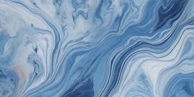 The primary subject of the image is a blue and white marbled surface, which appears to be a piece of art or a decorative item. The setting is a room with a blue and white color scheme, which complements the marbled surface. The visual style of the image is a close-up of the marbled surface, showcasing its intricate patterns and textures. The colors and mood of the image are predominantly blue and white, creating a serene and elegant atmosphere.