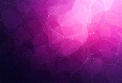 The primary subject of the image is a purple background with a pattern of triangles. The setting is a close-up of the purple background, which creates a visually striking and unique visual style. The colors and mood of the image are predominantly purple, giving it a calm and serene atmosphere.