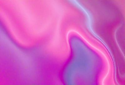 The primary subject of the image is a pink and purple swirl pattern. The setting is a pink background, and the visual style appears to be a digital art or illustration. The dominant colors in the image are pink and purple, creating a warm and vibrant atmosphere.