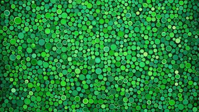 The primary subject of the image is a close-up of a green background with a pattern of green circles. The setting appears to be a wall or a surface with a green hue. The visual style of the image is a close-up of a pattern, which gives it a digital art or illustration appearance. The dominant colors in the image are green, creating a calm and soothing atmosphere.
