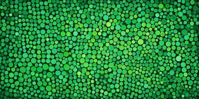 The primary subject of the image is a large, green, circular pattern. The setting is a green background, which creates a vibrant and lively atmosphere. The visual style is a combination of a photo and a digital art, as it appears to be a close-up of a pattern, possibly a painting or a digital design. The colors and mood are predominantly green, giving the image a fresh and natural feel.