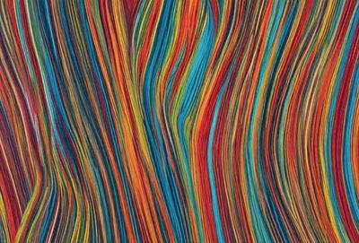 The primary subject of the image is a colorful, abstract design featuring a mix of blue, orange, and red hues. The setting is a wall, and the visual style appears to be a combination of digital art and illustration. The colors and mood of the image are vibrant and energetic, creating a lively and engaging atmosphere.