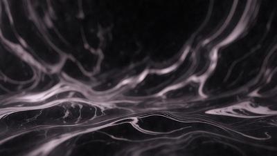 The primary subject of the image is a black and white marble surface, which appears to be a part of a wall or a countertop. The setting is a dark room, and the visual style is a close-up of the marble surface. The colors and mood of the image are predominantly dark and moody, with the black and white marble adding a sense of depth and contrast to the scene.