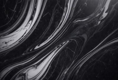 The primary subject of the image is a marble countertop with a black and white pattern. The setting is a kitchen, and the visual style is a close-up of the marble countertop. The colors and mood of the image are predominantly black and white, giving it a classic and elegant appearance.