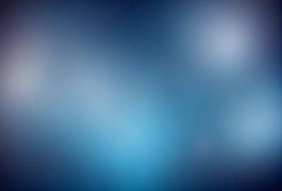 The primary subject of the image is a blue sky with a few clouds. The setting is a dark blue background, which creates a contrast with the lighter blue sky. The visual style is a photo, capturing the beauty of the sky. The colors and mood of the image are predominantly dark blue, creating a calm and serene atmosphere.