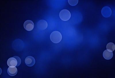 The primary subject of the image is a blue sky with a few white dots scattered throughout. The setting is a night sky, and the visual style appears to be a photo. The colors in the image are predominantly blue and white, creating a calm and serene atmosphere.