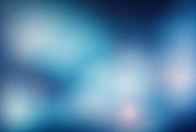 The primary subject of the image is a blue, swirling, and somewhat blurry background. The setting appears to be a dark, possibly indoor environment. The visual style of the image is a combination of a photo and a digital art or illustration, as it has a somewhat surreal and artistic appearance. The dominant colors in the image are blue and purple, creating a calming and serene atmosphere.