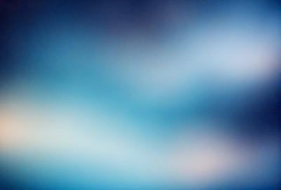 The primary subject of the image is a blue sky with clouds. The setting is a clear day with a blue sky and clouds. The visual style is a photo of the sky. The colors and mood are predominantly blue and serene.