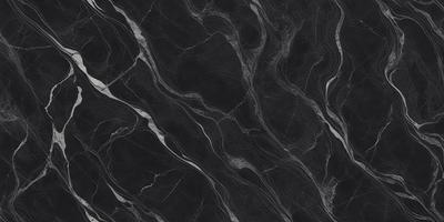 The primary subject of the image is a black marble countertop. The setting is a kitchen, with the countertop being the main focus of the scene. The visual style is a close-up of the marble countertop, showcasing its texture and pattern. The colors and mood of the image are predominantly dark, with the black marble countertop being the main source of contrast and visual interest.