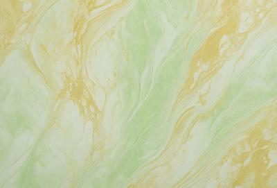 The primary subject of the image is a green and yellow marbled wallpaper. The setting is a wall, and the visual style is a patterned wallpaper. The dominant colors are green and yellow, creating a warm and inviting atmosphere.