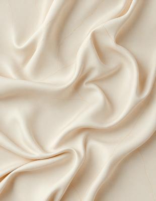 The primary subject of the image is a white sheet of fabric, which is the main object, scene, or focus of the image. The setting or background is a white sheet of fabric, and the visual style is a photo. The colors and mood of the image are predominantly white, giving it a clean and simple appearance.