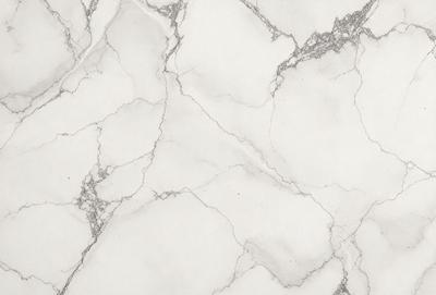 The image features a white marble wall with a pattern of holes and grooves. The wall appears to be a part of a building, possibly a bathroom or a kitchen. The marble wall has a unique texture and pattern, giving it a distinctive and elegant appearance.