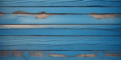 The primary subject of the image is a blue wooden wall with a visible crack. The setting is a room with a blue wooden wall, and the visual style is a photo. The dominant colors are blue and white, creating a calm and serene atmosphere.