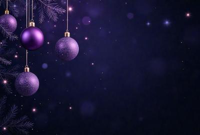 Purple Christmas ornaments hanging from a tree.