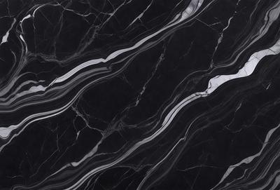 The primary subject of the image is a black marble countertop. The setting is a kitchen, with the countertop being the main focus of the scene. The visual style is a close-up of the marble countertop, showcasing its texture and pattern. The colors and mood of the image are predominantly dark, with the black marble countertop being the main source of contrast.