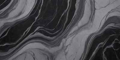 The primary subject of the image is a close-up of a marble countertop. The setting is a kitchen, with the countertop being the main focus of the scene. The visual style is a black and white photo, which adds a classic and timeless feel to the image. The dominant colors are black and white, creating a stark and elegant atmosphere.