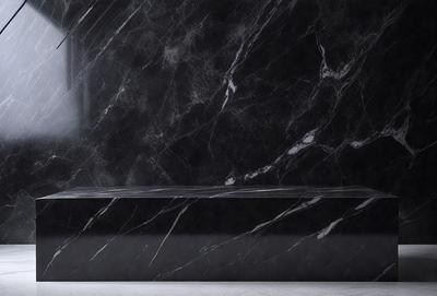The primary subject of the image is a black marble countertop. The setting is a bathroom, with the countertop being the main focus of the scene. The visual style is a photo, capturing the marble countertop's texture and appearance. The colors and mood of the image are predominantly dark, with the black marble countertop being the main source of contrast and visual interest.