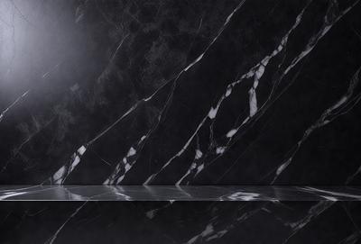 The primary subject of the image is a marble countertop with a black marble pattern. The setting is a bathroom, and the visual style is a photo. The countertop has a black and white marble pattern, and the overall atmosphere is elegant and sophisticated.