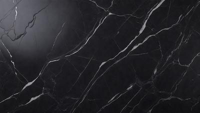 The primary subject of the image is a black marble countertop. The setting is a kitchen, with the countertop being the main focus of the scene. The visual style is a close-up of the marble countertop, showcasing its texture and pattern. The colors and mood of the image are predominantly dark, with the black marble countertop being the main source of contrast.