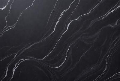 The primary subject of the image is a black and white marble countertop. The setting is a kitchen, with the countertop being the main focus of the scene. The visual style is a close-up of the marble countertop, showcasing its intricate patterns and textures. The colors and mood of the image are predominantly black and white, giving it a classic and elegant appearance.