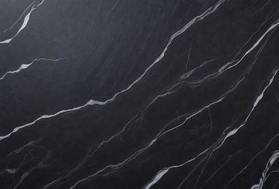 The primary subject of the image is a black marble wall with a pattern of white veins. The setting is a room with a black marble floor. The visual style is a close-up of the marble wall, showcasing its unique texture and pattern. The colors and mood of the image are predominantly black and white, giving it a sophisticated and elegant appearance.