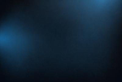 The primary subject of the image is a dark, blue-toned background. The setting is a black background, which creates a dramatic and moody atmosphere. The visual style is a black and white photo, giving the image a classic and timeless appearance. The colors and mood of the image are predominantly dark and mysterious, with the blue hue adding a touch of calmness to the overall scene.