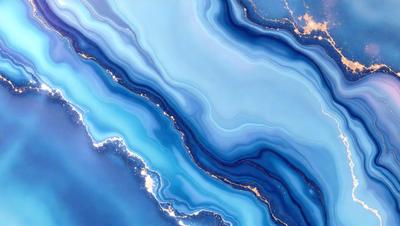 The primary subject of the image is a blue and white ocean wave. The setting is the ocean, with the wave being the main focus of the image. The visual style is a photo of the ocean, capturing the beauty of the wave. The dominant colors are blue and white, creating a serene and calming atmosphere.