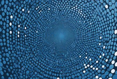 The primary subject of the image is a blue circle with a pattern of white dots. The setting is a blue background, and the visual style appears to be a digital art or illustration. The dominant colors are blue and white, creating a calm and serene atmosphere.