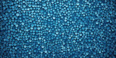 The primary subject of the image is a blue background with a pattern of white circles. The setting is a blue wall, and the visual style is a patterned background. The dominant colors are blue and white, creating a calm and soothing atmosphere.