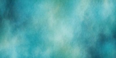 The primary subject of the image is a large, blue, cloudy sky. The setting is a vast, open space with no visible landmarks or objects. The visual style is a combination of a photo and a painting, creating a unique and artistic representation of the sky. The colors and mood of the image are predominantly blue, with a hint of green, giving it a serene and calming atmosphere.