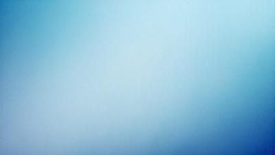 The primary subject of the image is a large, empty blue sky. The setting is a vast, open space with no visible landmarks or objects. The visual style is a natural, untouched landscape. The colors and mood are predominantly blue, creating a serene and peaceful atmosphere.
