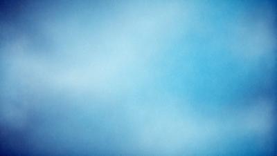 The primary subject of the image is a blue sky with clouds. The setting is a cloudy day, and the visual style is a photo. The dominant colors are blue and white, creating a calm and serene atmosphere.
