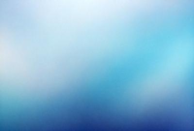 The primary subject of the image is a large, blue, cloudy sky. The setting is a vast, open space with no visible landmarks or objects. The visual style is a natural, outdoor scene with a focus on the sky. The colors and mood are predominantly blue, creating a serene and peaceful atmosphere.