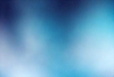 The primary subject of the image is a blue sky with clouds. The setting is a vast, open space with no visible landmarks or objects. The visual style is a natural, outdoor scene. The colors and mood are predominantly blue, creating a calm and serene atmosphere.