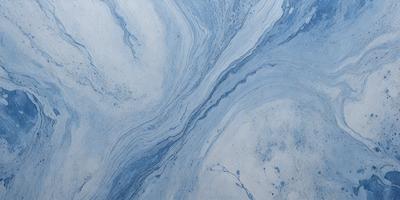 The primary subject of the image is a blue and white swirling pattern, which appears to be a part of a blue and white marbled surface. The setting is a room with a blue and white marbled wall, and the visual style is a close-up of the swirling pattern. The colors and mood of the image are predominantly blue and white, creating a calm and serene atmosphere.
