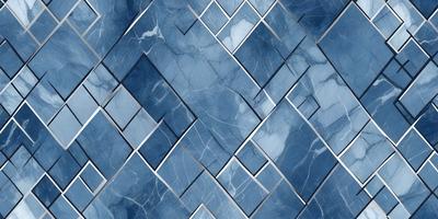 The primary subject of the image is a blue and white marble tile pattern. The setting is a blue and white marble tile wall, which serves as the background. The visual style is a close-up of the tile pattern, showcasing the intricate design. The colors and mood of the image are predominantly blue and white, creating a clean and elegant atmosphere.
