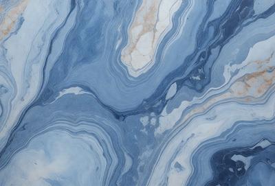 The primary subject of the image is a blue and white marble tile. The setting is a wall with the marble tile as the main object. The visual style is a close-up of the tile, showcasing its intricate design. The dominant colors are blue and white, creating a calm and elegant atmosphere.