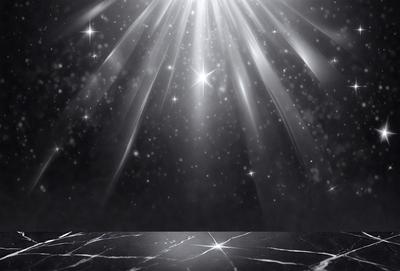 The primary subject of the image is a bright, shining light source, possibly a star or a light bulb, located in the middle of the scene. The light source is surrounded by a dark background, creating a contrasting effect. The visual style of the image appears to be a combination of a photo and digital art, as it captures the light source's glow and its reflection on a marble surface. The colors in the image are predominantly dark, with the light source being the main source of brightness. The