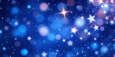 The primary subject of the image is a blue starry sky filled with bright stars. The setting is a nighttime scene, with the stars shining against a dark background. The visual style is a digital art or illustration, creating a sense of depth and beauty in the image. The colors and mood are predominantly blue and serene, evoking a sense of wonder and tranquility.